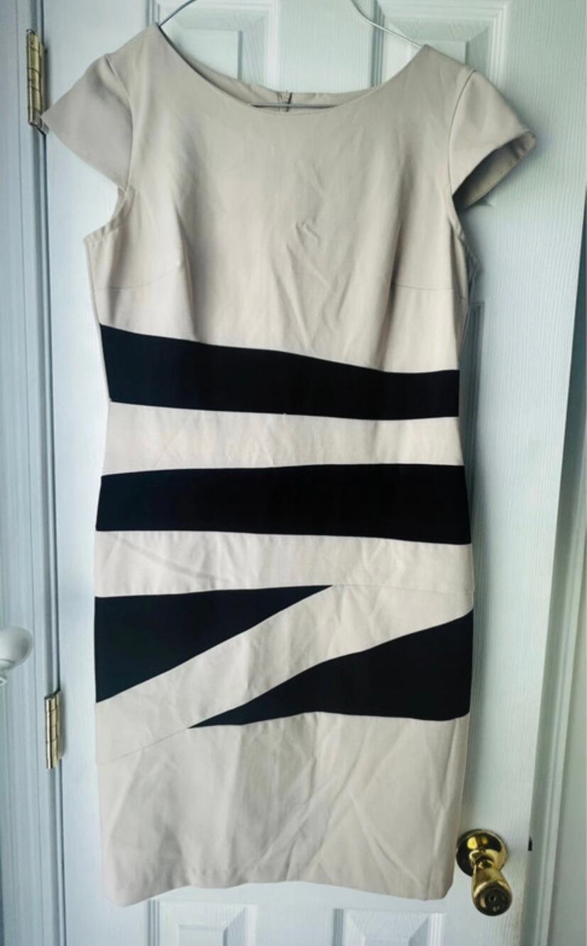 Alyx dress with black horizontal stripes and diagonal cutouts
Size 10
